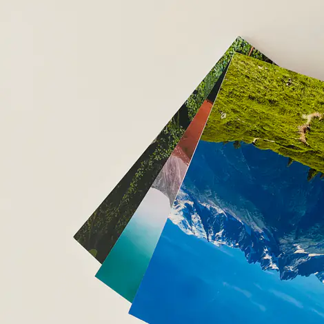 A fanned stack of printed Kikōbook travel books